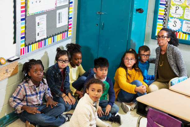istock Teacher and children doing school safety drill, lockdown 1454257598