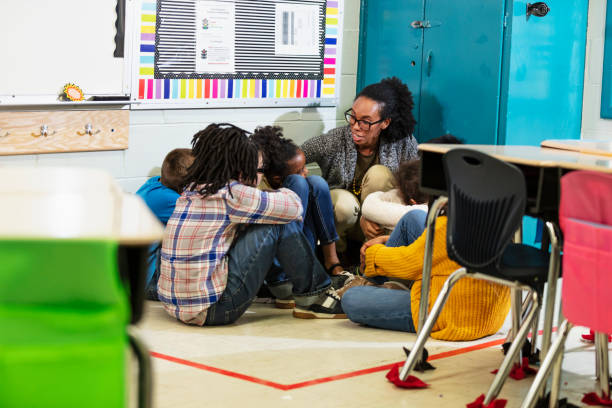 istock Teacher and children doing school safety drill, lockdown 1454257850