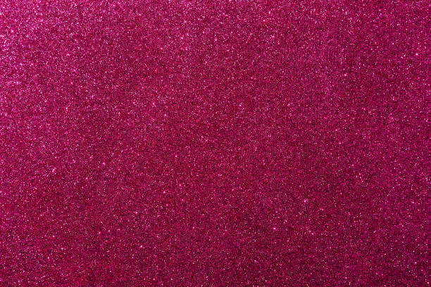 istock Background with sparkles. Backdrop with glitter. Shiny textured surface. Dark pink 1454258934