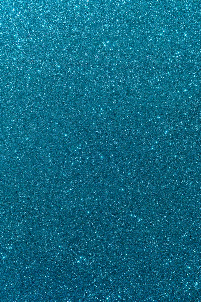 istock Background with sparkles. Backdrop with glitter. Shiny textured surface. Vertical image. Dark cyan 1454258938