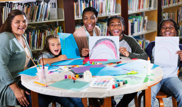 istock Children doing arts and crafts, show their drawings 1454260002