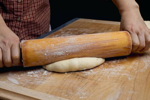 istock Close up of rolling out fresh dough. 1454261579