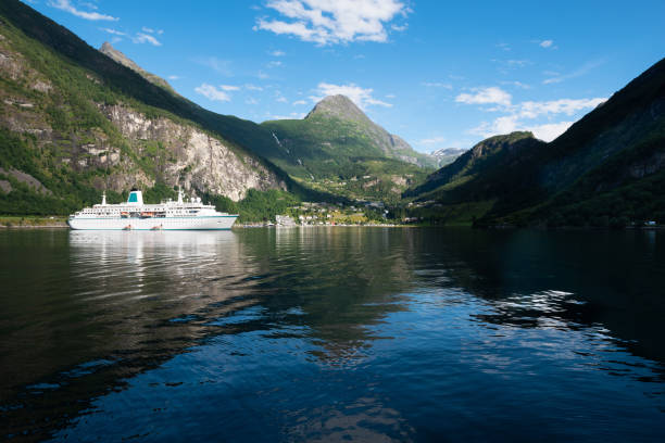 Nice scenic views of the high cliffs and deep waters of the beautiful UNESCO Geiranger Fjord stock photo
