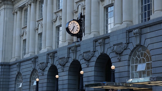 Auckland, New Zealand – November 16, 2022: The clock at the old train station in Auckland, New Zealand.