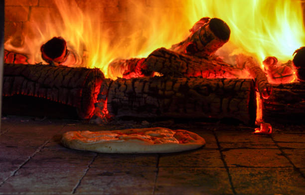 istock Baked pizza in the wood oven 1454263110