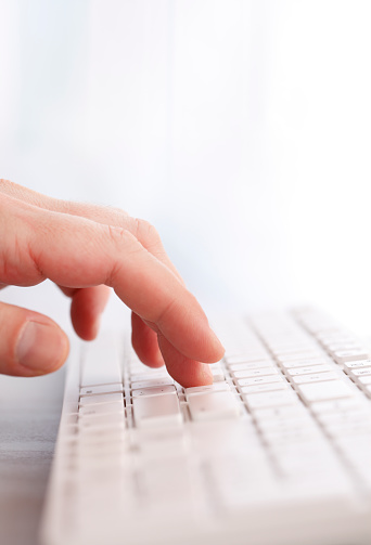 Close up of hands typing on laptop with copy space