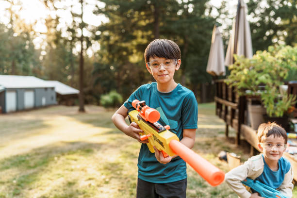 istock Brothers playing in the backyard 1454268920