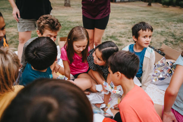 istock Opening birthday presents with friends 1454268951