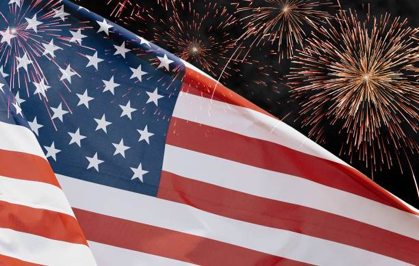 istock US American flag closeup with fireworks 1454274291
