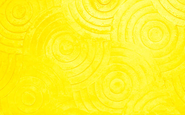 istock Yellow concrete texture wall background. Abstract orange paint floor stamped concrete surface clean polished on walkway in garden. Wallpaper pattern curved circle rough orange cement stone decorative 1454276547