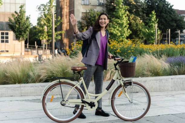 istock Japanese woman with a bicycle commuting to work 1454276566
