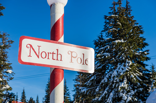 Vancouver, Canada - December 16,2022: A view of sign North Pole next to Santas Workshop building at the Peak of Vancouver(Grouse Mountain Ski Resort)
