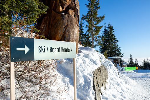 Vancouver, Canada - December 16,2022: View of sign Ski an Board Rentals on the Grouse Mountain Ski Resort