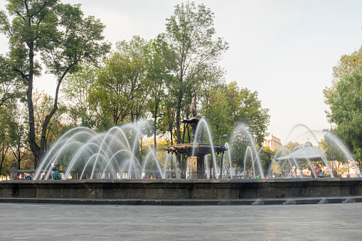 Flowing fountain at Prince's Island Park with the city view
