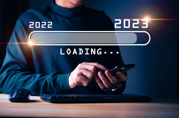 istock Businessman hand touching and pointing on loading bar year 2023 with virtual screen from 2022 to 2023, Businessman plan and increase of positive indicators in his business, Growing up business concepts. 1454289546