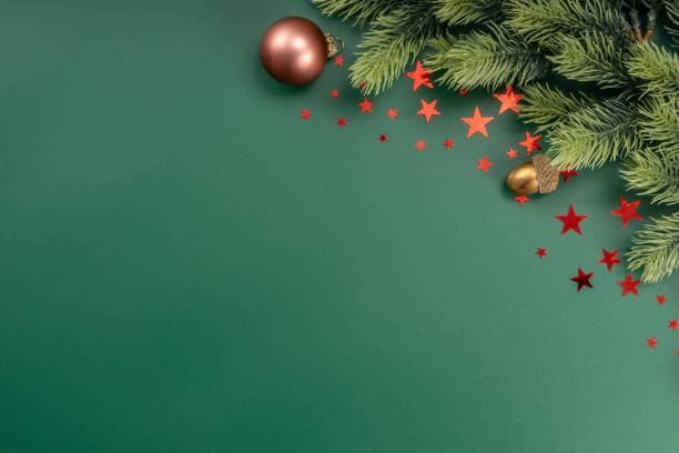 istock Christmas Decorations with stars confetti on green background. Holiday pattern background. 1454291150