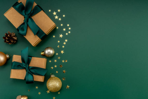 istock Christmas composition. Christmas gifts and decorations on green background. 1454291151