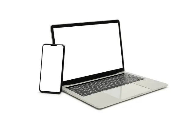 Photo of Laptop and smartphone, display. on white background workspace mock up design.