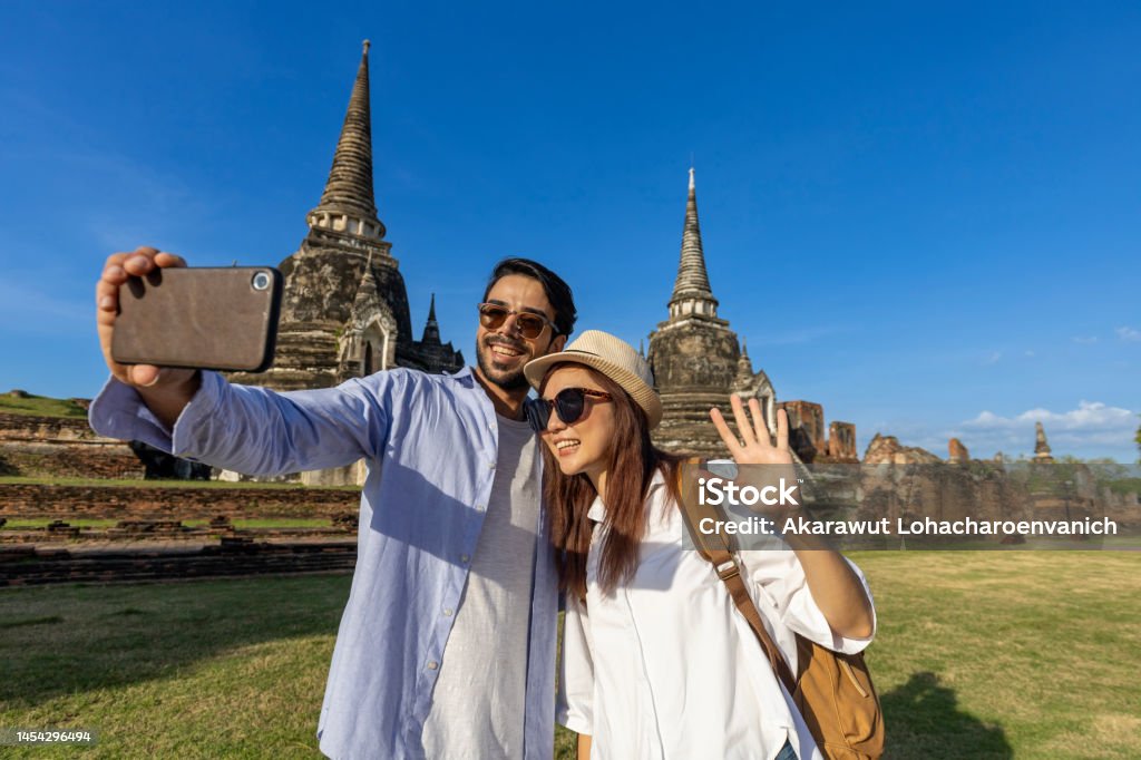Couple of foreign tourists take selfie photo at Wat Phra Si Sanphet temple, Ayutthaya Thailand, for travel, vacation, holiday, honeymoon and tourism Couple of foreign tourists take selfie photo at Wat Phra Si Sanphet temple, Ayutthaya Thailand, for travel, vacation, holiday, honeymoon and tourism concept Ayuthaya Stock Photo Couple of foreign tourists take selfie photo at Wat Phra Si Sanphet temple, Ayutthaya Thailand, for travel, vacation, holiday, honeymoon and tourism Couple of foreign tourists take selfie photo at Wat Phra Si Sanphet temple, Ayutthaya Thailand, for travel, vacation, holiday, honeymoon and tourism concept Ayuthaya Stock Photo