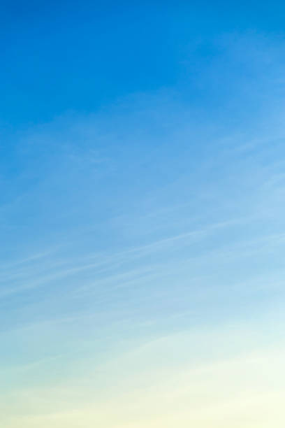 Vetical image awhite clouds in blue sky for background
