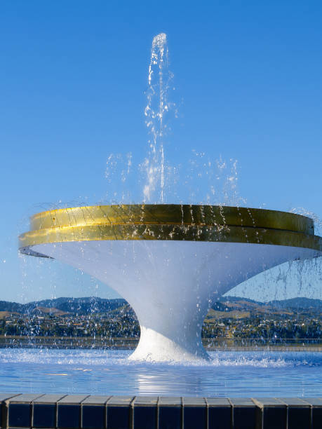 istock Water sprays skyward from circular fountain 1454299571