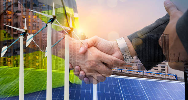 shaking hands, professional engineering solar planning blueprint with team, wind turbine and solar energy electrical engineer concept. - personal perspective wind turbine generator electricity imagens e fotografias de stock