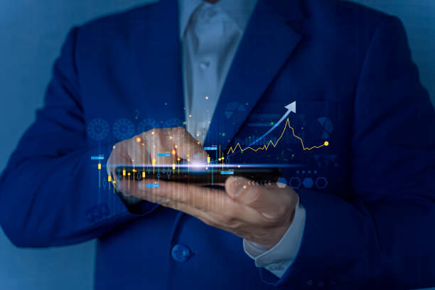 istock Trader in office working with Smartphone, FOREX graph hologram to analyze market behavior 1454301427