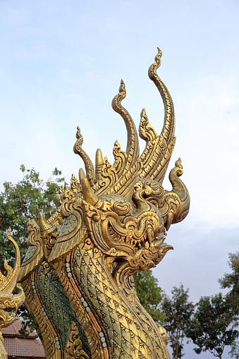 Golden Naga statue in Thai temple