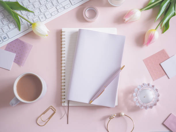 istock Pink flat lay top view women's office desk, women's workspace 1454301454