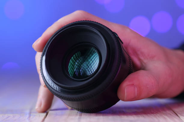 istock chinese 50mm lens in hand on table 1454302063