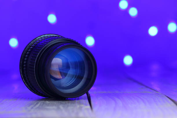 istock old 50mm lens on blue background 1454302066