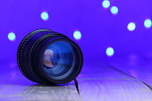 old 50mm lens on blue background