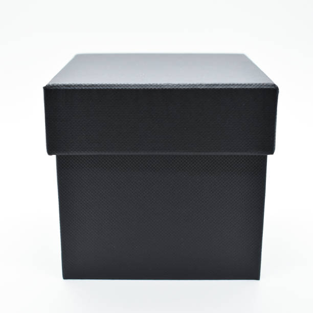 istock black paper box on white background, packaging industry 1454303925