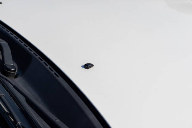 istock windshield washer nozzle over car bonnet closeup 1454304015