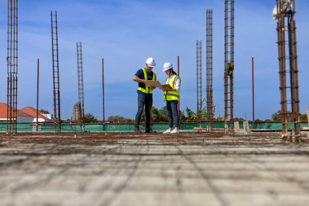istock Team of engineering architect inspector and contractor having discussion while examining the quality of construction work of real estate development project concept 1454304051