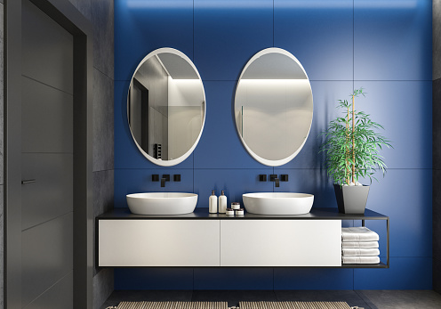 Luxurious bathroom with natural stone tiles and cabinet. Oval mirror. Scandinavian bathroom concept. 3d rendering