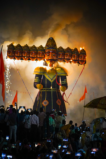 Ravan Dahan, according to Hindu culture, Effigies of Ravana are burned on Vijayadashami, in India at many places, Ravana burning in dussehra festival, crowd or people taking picture with smartphone