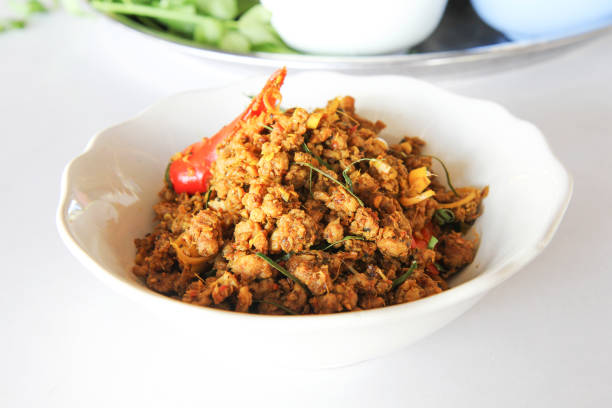 Southern Stir-Fried Pork with Yellow Curry Paste (Thai name Kua Kling) Thai food and selective focus.