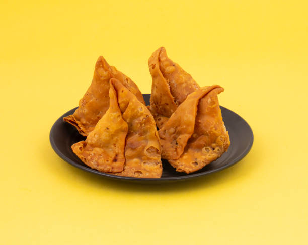 istock Indian Street Food Samosa or Samosas is a Crispy And Spicy Triangle Shape Snack 1454305968