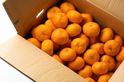 Mandarin oranges in a cardboard box