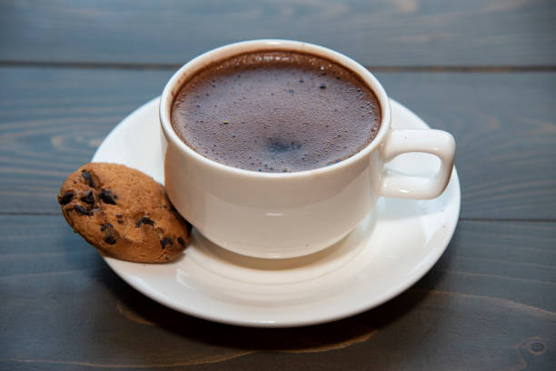 istock coffee in a white cup and saucer.with cookies 1454310780