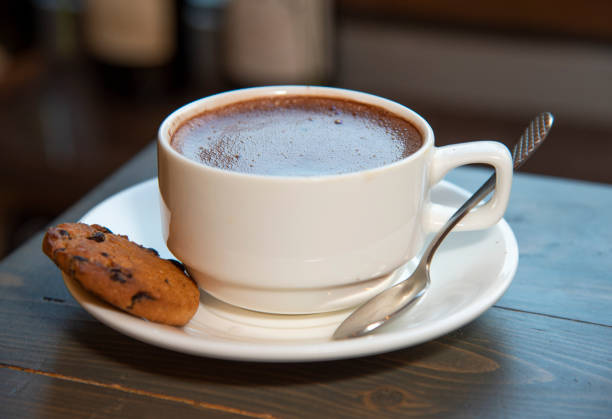 istock coffee in a white cup and saucer.with cookies 1454310789