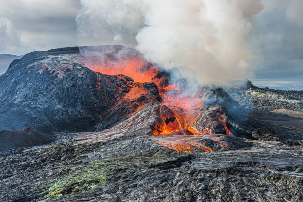 istock glowing lava and steam over volcano 1454310980