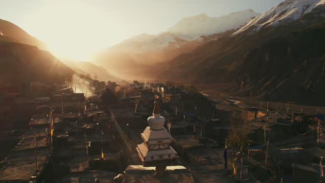 Flying around avalley in Himalayas. Mountain valley in Himalayas from the aerial view. Drone footage of a mountain valley in Himalayas. Namche Bazaar town, on the way to Everest Base Camp, Nepal
