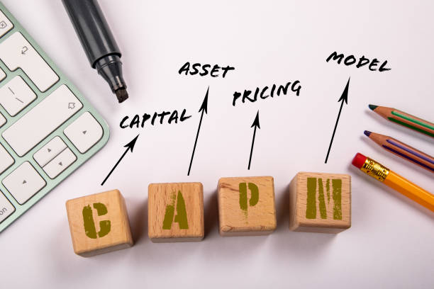 istock CAPM - Capital Asset Pricing Model. Wooden blocks on a white office table 1454315658