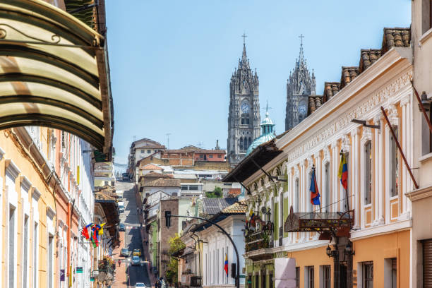 Street of Quito and Basilica del Voto Nacional. stock photo