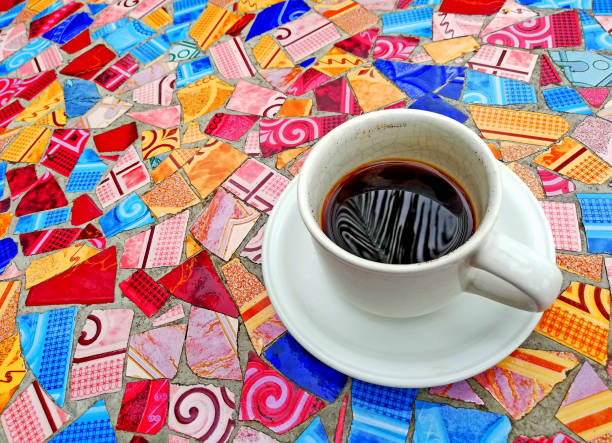 A cup of coffee on the mosaic ceramic table