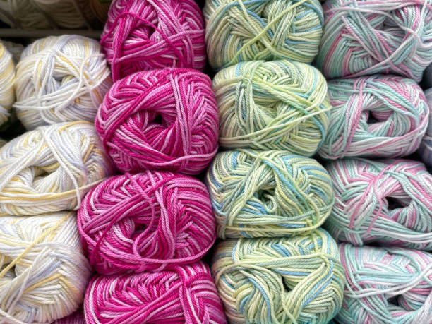 istock Multi colored balls of yarn for knitting. Woolen threads for needlework. Texture 1454321171