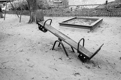 Photography on theme empty playground with metal swing for kids on background natural nature, photo consisting from playground with steel swing, swing on old playground in countryside without people