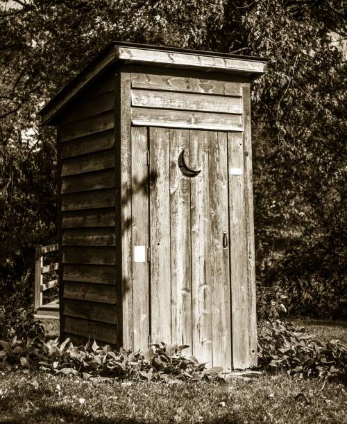istock Wooden outhouse in the yard 1454329128